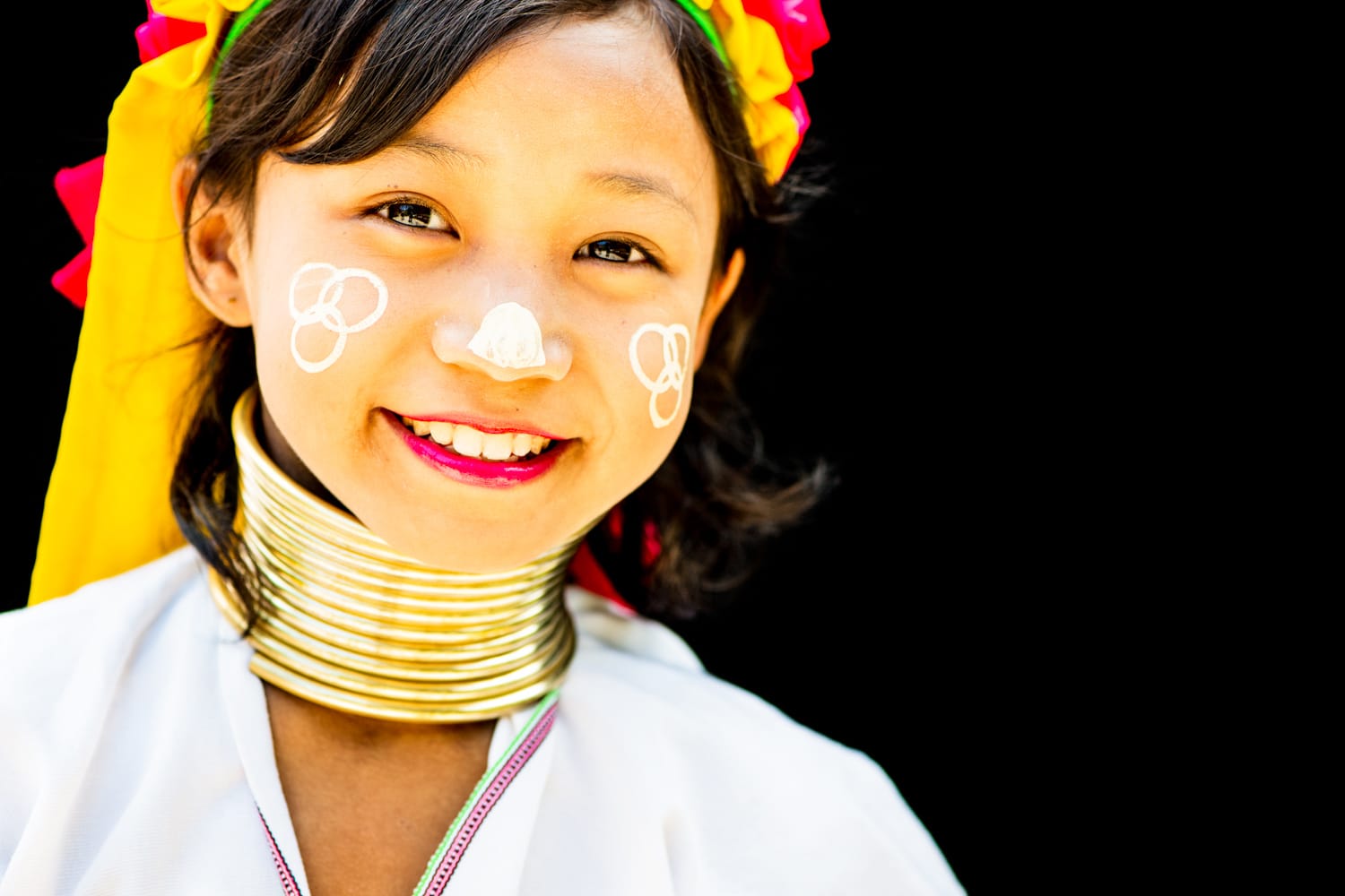 Kayan long neck girl portrait on a black background