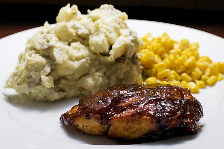 BBQ chicken, potato salad, and corn
