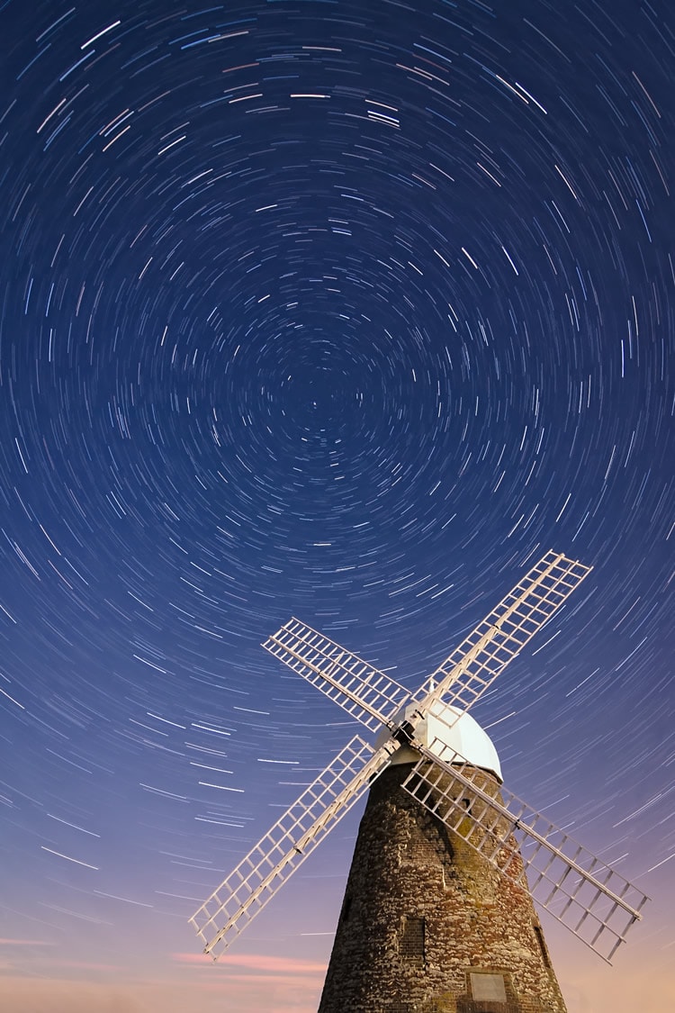 As the windmills and the heavens turn