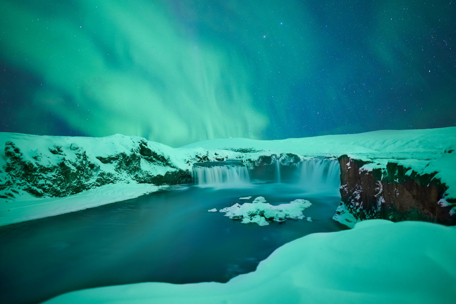 Waterfalls with Northern Lights by Marc Marchal