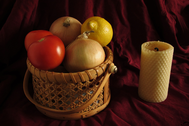 Still life with fruit and candle